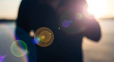 Silhouette with Lens Flare at Sunset