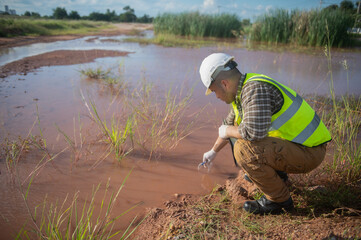 An environmental engineer examines the abundance of natural water sources and ecosystems