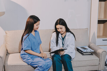 A doctor uses a stethoscope to check the heartbeat of his patient. Patients must undergo a yearly...