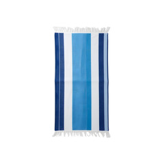 Striped beach towel in blue and white colors on a flat surface  