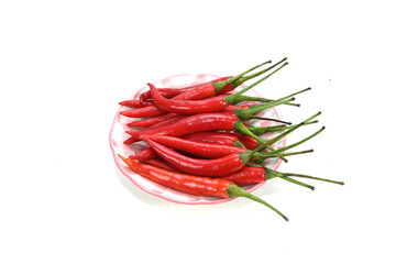Red hot chili peppers on a  plate isolated on a white background