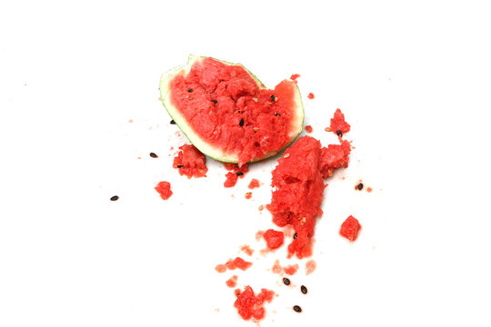 Close-up of a broken watermelon isolated on a white background.