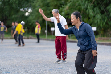 Obraz premium asian senior woman petanque practice on playing field,elderly athlete,sport,workout,health,competition