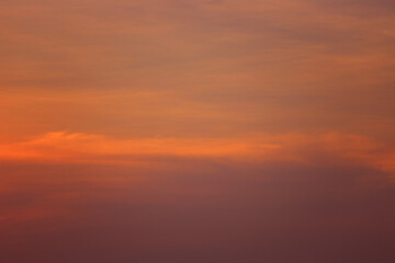 Soft pastel hues during sunset sky with subtle clouds creating a serene atmosphere ideal for...