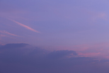 Serene Twilight Sky with Soft Hues of Purple and Pink, Capturing the Tranquil Beauty of Dusk in a...