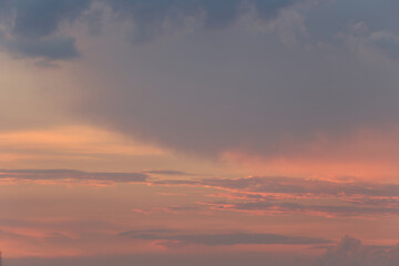 Beautiful Sunset Overlaid with Clouds Illuminated by Soft Pink and Orange Hues, Capturing the...