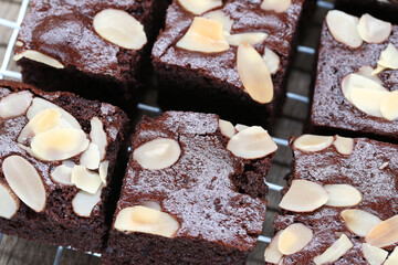 Deliciously Moist Chocolate Brownies Topped with Sliced Almonds on a Cooling Rack, Perfect for Sweet Treats or Desserts in Any Occasion