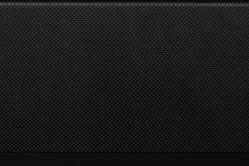 Textured black surface with a subtle pattern, suitable for backgrounds of various design projects...