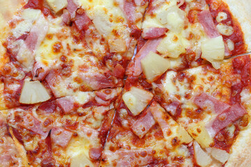 Freshly Baked Pizza Topped with Ham, Pineapple, and Cheese Perfect for a Delicious Meal or...