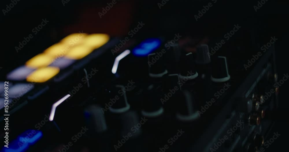 Poster close up of mixer control with falling led light using by dj for play music set playlist at party