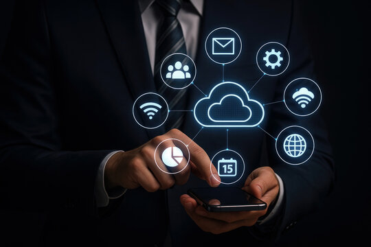 Businessman using smartphone interacts with digital cloud computing interface showing network icons email calendar wifi group chart globe