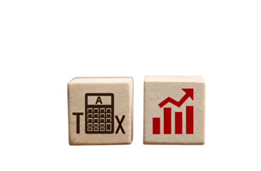 A wooden block with the word TAX on it and an icon of a calculator beside that cube.