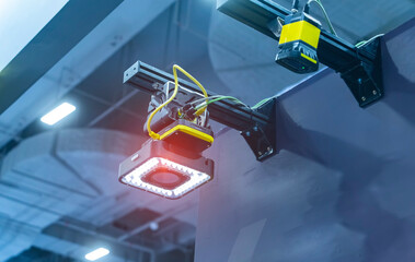 transducer on industrial machine robot in assembly line with robotic vision sensor camera system in...