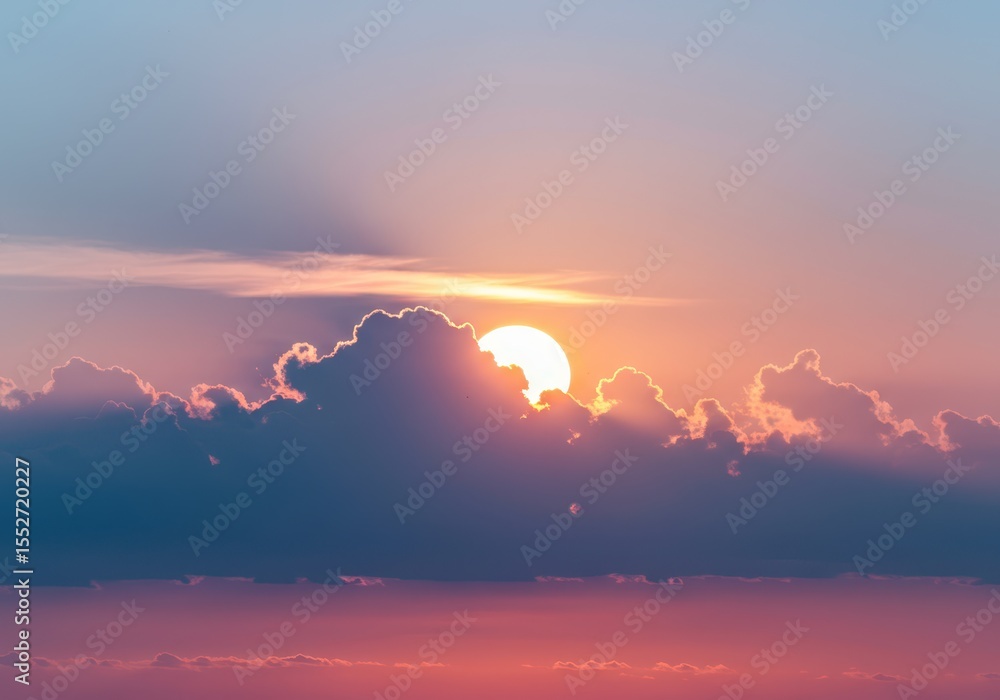 Poster sun setting behind clouds creating a colorful and peaceful sky