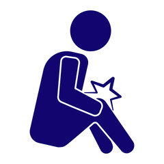 person sitting down and grabbing at the knee in pain. 