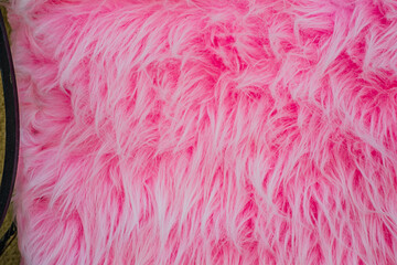 Fototapeta premium Soft and vibrant pink fur creates a warm and inviting atmosphere perfect for lounging