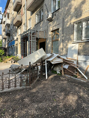 Construction debris lies at the entrance to the building