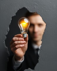 Entrepreneur Holding Lightbulb Idea Concept