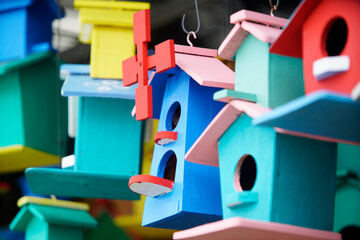 Colorful Birdhouses Hanging in a Bright Outdoor Display