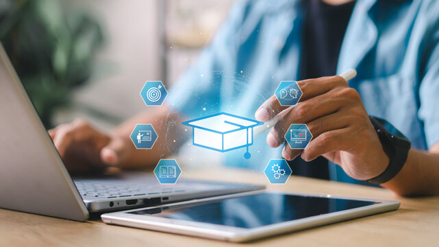 Student using stylus on tablet with graduation cap icon and digital education interface. Concept of e-learning, virtual class, academic development, and edtech tools.