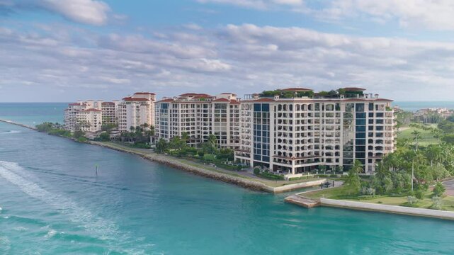 Discover the stunning and breathtaking scenery of Fisher Island, a luxurious enclave nestled in Miami, Florida, showcasing beautiful waterfront views and providing an upscale living experience