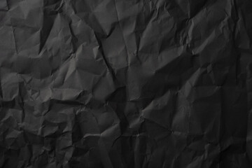 Crumpled dark paper background perfect for creative projects, design elements, or textures