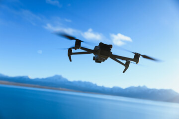 Drone flying under blue sky