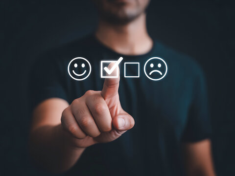 Man selecting satisfaction level with floating emoji scale and checked option interface