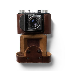 A vintage camera with a leather case, showcasing classic photography equipment.