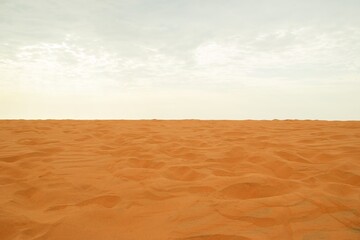 Red Sand Dunes Stretching to the Horizon Under a Bright Sky. Desert Landscape. Mui Ne, Vietnam.