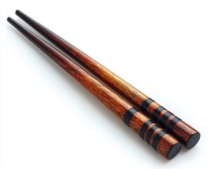 Elegant wooden chopsticks with intricate detailing on a clean background