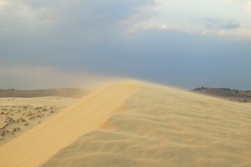 Sand Dune Landscape Under a Dramatic Sky, Beauty of Nature in Motion. Mui Ne, Vietnam, White Dunes.