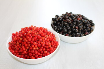 Red and black currants are two different types of berries that belong to the same genus. Both types of currants are rich in vitamins and antioxidants.