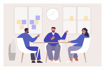 Diverse team collaborating and discussing ideas around a table in a modern office