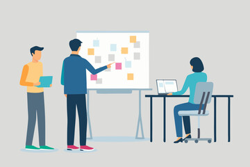 Team collaborating on a project using a whiteboard and laptop in an office setting