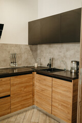 Modern Kitchen with Wooden Cabinets and Black Countertops