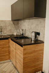Modern Kitchen with Wooden Cabinets and Black Countertops