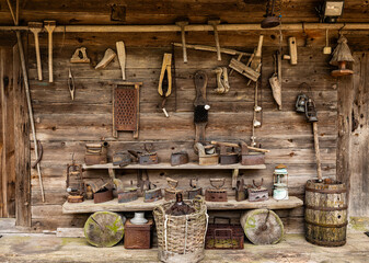 old rusty tools on the wooden wall