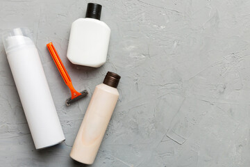 shaving man set. shaving machine, towel, lotion and shaving foam on colored background. Men bath Accessories top view