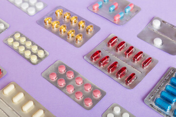 too many different pill of various blisters with different pills Medicines storage at home concept Medication storing. A pile of medicine in blister packs. Pharmaceutical blister packs