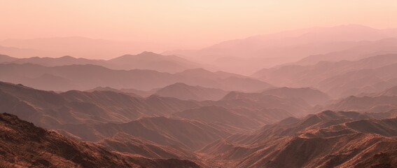 Naklejka premium Misty mountain ranges at dawn