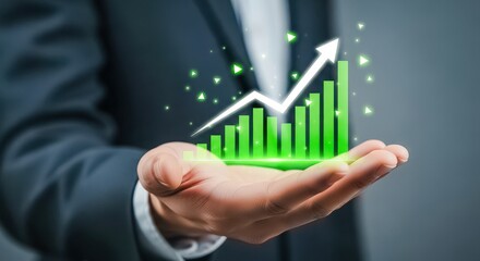 Businessman holding a glowing green financial growth chart with an upward arrow and sparkling particles