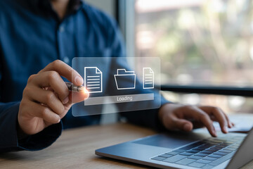 Businessman using laptop uploading documents online digital file transfer