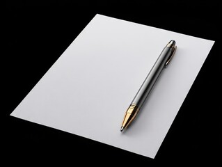A silver pen with gold accents rests on a blank white sheet of paper against a stark black background.  The image is sharply focused, highlighting the pen's metallic sheen 