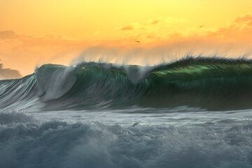 Powerful waves captured at sunrise off the coast of Sydney, Australia, using a motion blur effect...