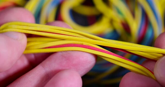 hold a large number of multi-colored rubber bands for office or money packaging, empty scattered thin rubber bands of different colors for packaging and organizing paper money