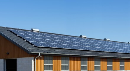 Solar panels roof blue sky renewable energy building. Photovoltaic system industrial facility sustainable technology. Green energy concept