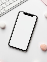 Blank smartphone display on desk with keyboard and pastel accessories