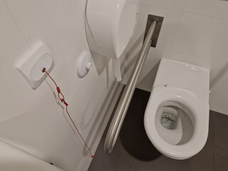 toilets for wheelchair users and disabled people have a tilting mirror that points to ground...