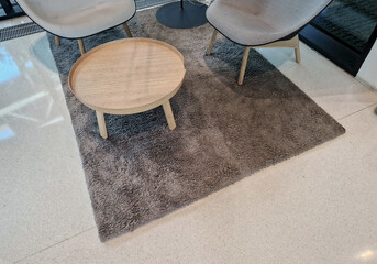 A table with a high edge means that if a drink spills, it won't damage the expensive shaggy rug...